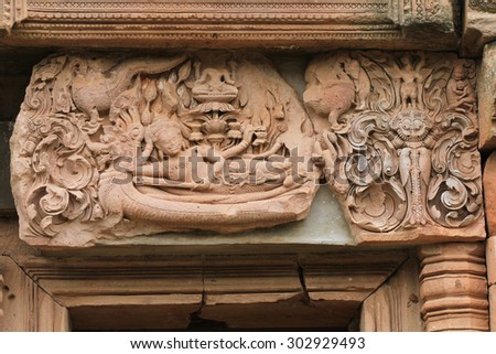 Art sandstone carvings in the ancient ornamental pediment above the entrance to the castle. Prasat Hin Phanom rung  Historical Park, sand stone castle in Buriram, Thailand.