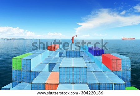 Commercial Vessels Marine Bulk Containers were traveling in sea freight under blue sky and cloud.