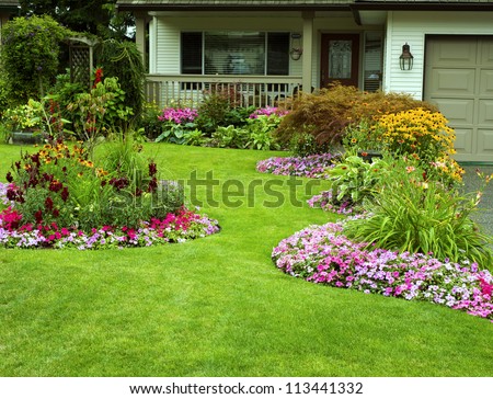 Front Yard Landscaping.  A beautifully manicured front yard with a garden full of perennials and annuals.