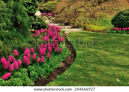Garden Path. Flower path leads to stairs.