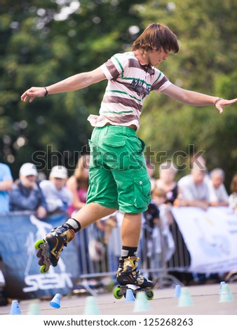 MOSCOW - JULY 21: Gorky Park, Artyom Andreev performs a onefoot slalom element - Russian Rollerskating Federation Championship on July 21, 2012 in Moscow