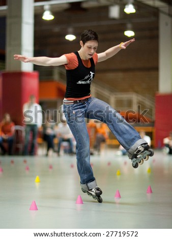 MOSCOW - MARCH 21 : Rollerskater Chloe Seyres (France) performs one wheel spin element at Adrenaline Skatepark during European Slalom Battle Championship March 21, 2009 in Moscow, Russia.