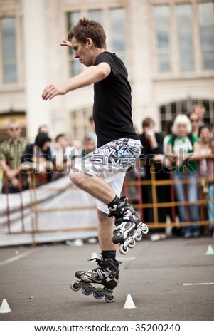 MOSCOW - JULY 25 : Andrey Shitov (Russia) performs one wheel spin element at Luzhniki Olympic Arena during Russian Rollerskating Federation Championship July 25, 2009 in Moscow.