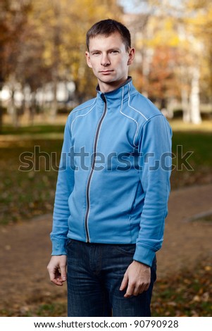 Outdoor portrait of a young man in a sport jacket - shallow DOF