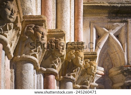 Detail of a Gothic wall with beautiful historical Gothic capitals. Church of Santa Maria de Guadalupe Monastery, Extremadura, Spain. Monks built the cloister in the 14th century.