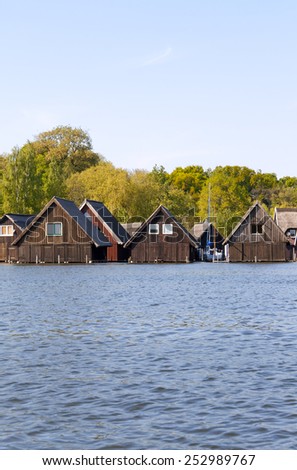 A boathouse is a building designed for the storage of boats, normally smaller craft for sports or leisure use. These are typically located on open water, in Roebel, a little town on the Mueritz Lake.