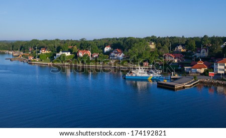 Beautiful super wide-angle aerial view of Stockholm archipelago skerries and suburbs with classic sweden scandinavian designed cottage houses