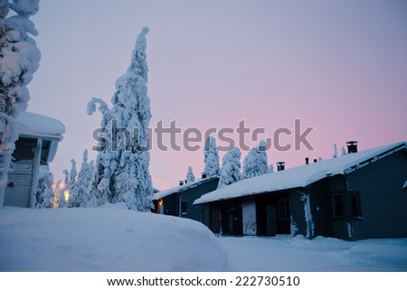 Beautiful snowy winter landscape with cottage cabin village in christmas vacation time near ski resorte