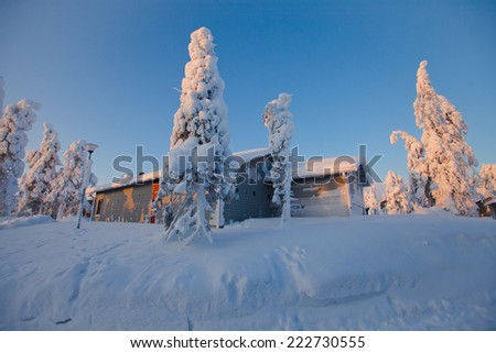 Beautiful snowy winter landscape with cottage cabin village in christmas vacation time near ski resorte