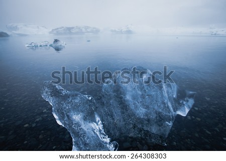 Beautiful cold landscape picture of icelandic glacier lagoon bay with ice and glacier, arctic landscape, antarctic landscape with melting glaciers, frozen lake, greenland