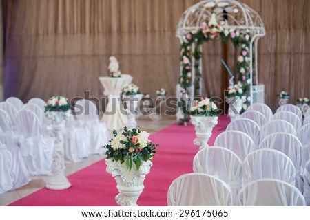 Beautiful wedding ceremony design decoration elements with arch, floral design, flowers, chairs and balloons