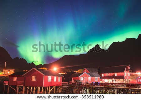 Beautiful picture of massive multicoloured vibrant Aurora Borealis, Aurora Polaris, also know as Northern Lights in the night sky over Norway, Lofoten Islands