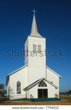 A well maintained old country church on a sunny autumn day.