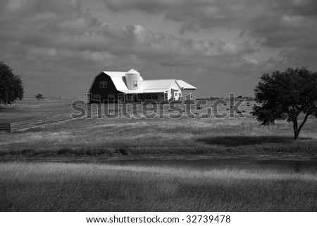 It is a ranch house on the open hillside country.
