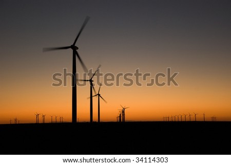 Evening last glow on a field of a wind farm