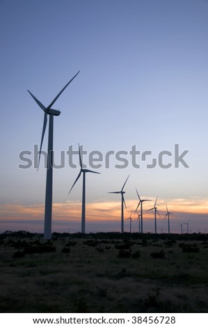 A row of wind towers on the range.