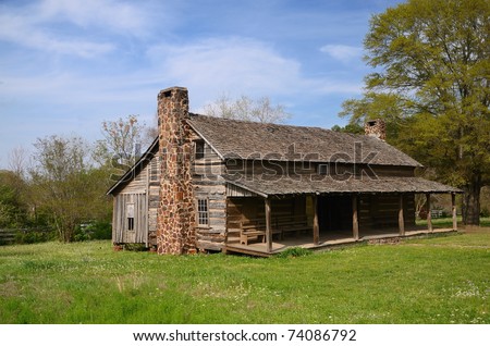 Old rustic dog trotter 1840 home with front porch and two fireplaces.