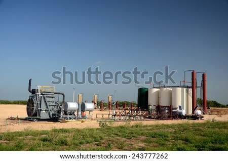 Processing facility including turbine and compressor for processing oil and gas from a six well location.