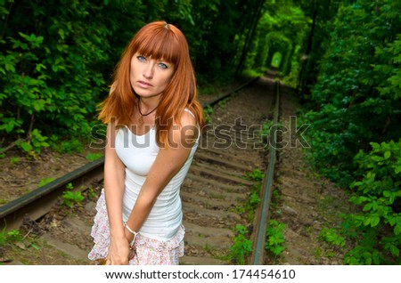 redhead sad girl in the tunnel of love, ukraine