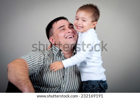 Dad and son in the studio, dad and son hugging