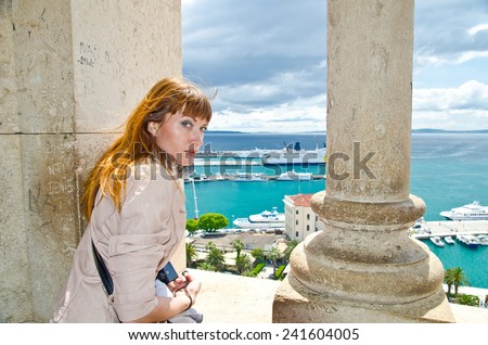 Split, Croatia, the old town. View from the tower. girl looking down. girl admiring the view of Split from the bell tower of the Cathedral of St. Duje