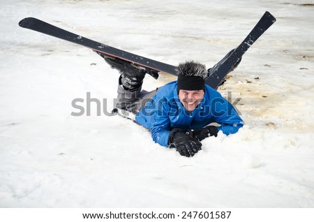 male skier fell. snow ski mountain in the Carpathians, Ukraine. Ski resort in the snow