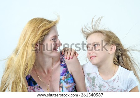 CLoseup portrait of happy white mother and young daughter - isolated. Happy family people concept.