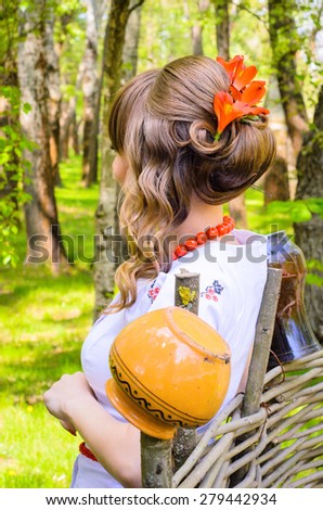 Portrait of beautiful ukrainian woman. Ukrainian girl in national clothes