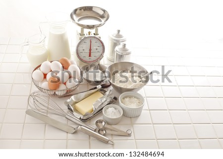 ingredients and tools to make a cake, flour, butter, sugar,eggs