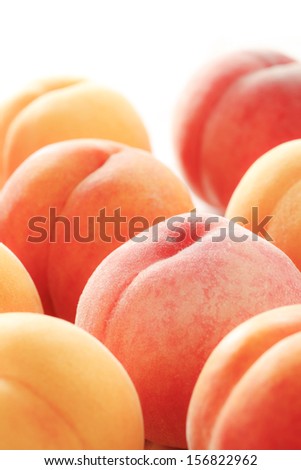 Shot in white back a ripe peach of high-grade wide