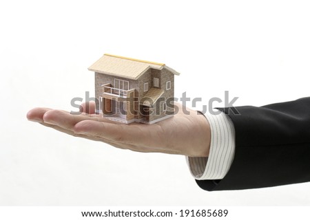 With the sale authorized, a model of the house, businessman