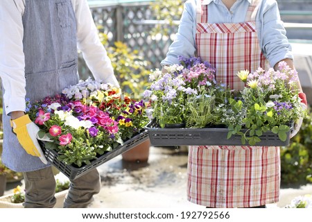 Enjoy gardening couple, hand with a seedling