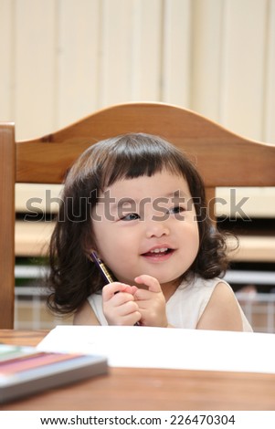 Girl to study at the table