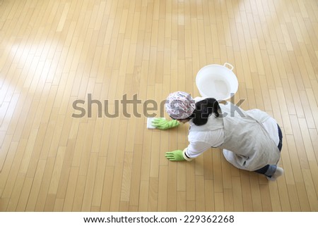 Overhead image of women that have a floor cleaning