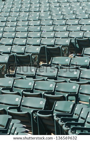 green stadium seats empty after a game.