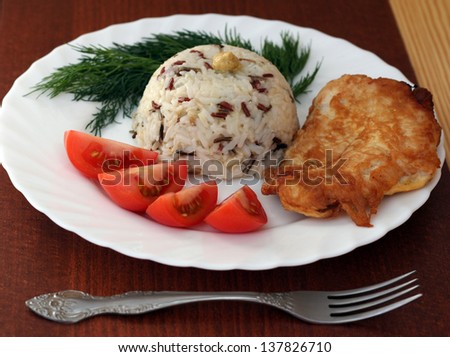 chicken fillet with rice and tomatoes