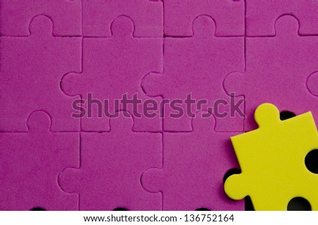 Textured puzzle pieces that show being different, original, special... over black background