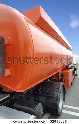 Orange petrol tanker over a blue sky