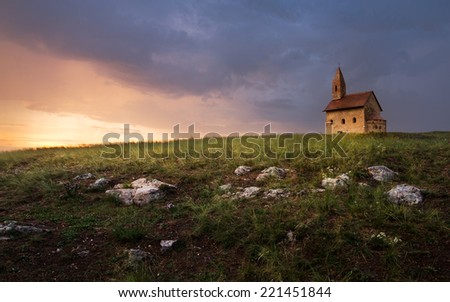 Old Roman Catholic Church of St. Michael the Archangel on the Hill at Sunset in Drazovce, Slovakia