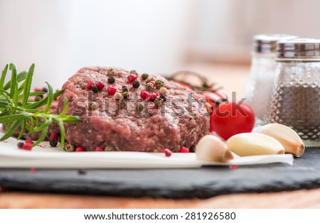 Raw Minced Hamburger Meat with Herb and Spice Prepared for Grilling
