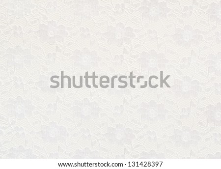 White lace with small flowers on the white background