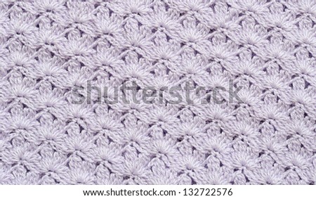 Background of lilac crochet fabric