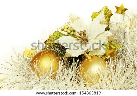 Christmas balls with tinsel and poinsettia on a white background