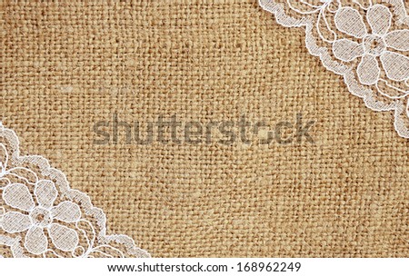 Canvas background with white lace in corners