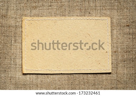 Paper card on beige canvas background