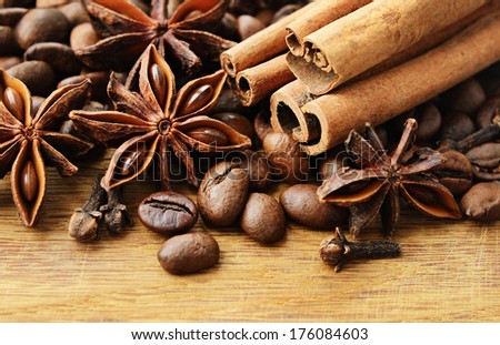 Fragrant spices and coffee on a wooden background