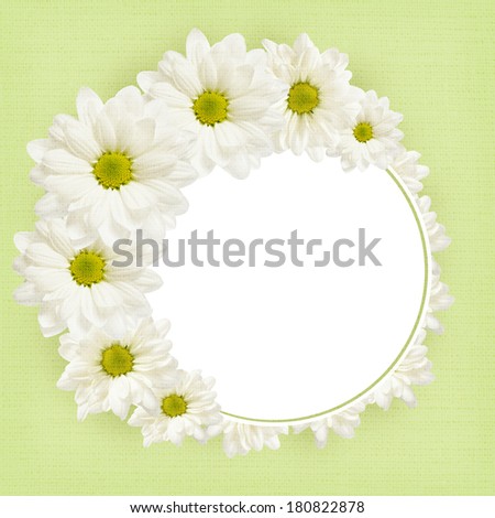 Background with daisy flowers and round frame