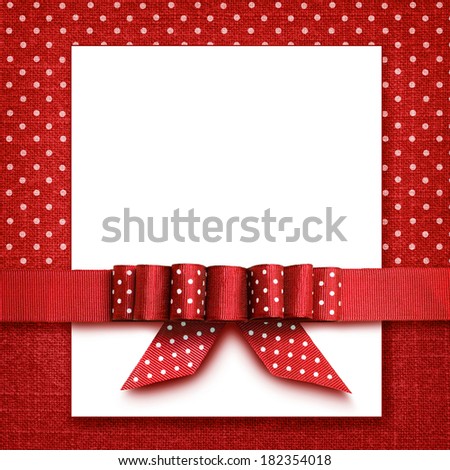 Red ribbon with a bow on red and white background