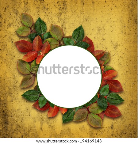 Autumn round frame with colorful leaves on yellow background