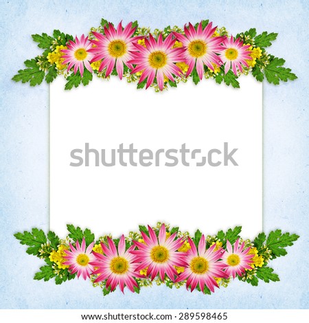 Flowers arrangement and a card on blue background